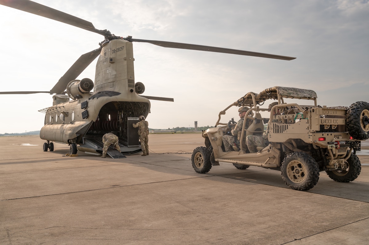SPEARS students prepare to load their MRZR vehicle on a CH-47 Chinook