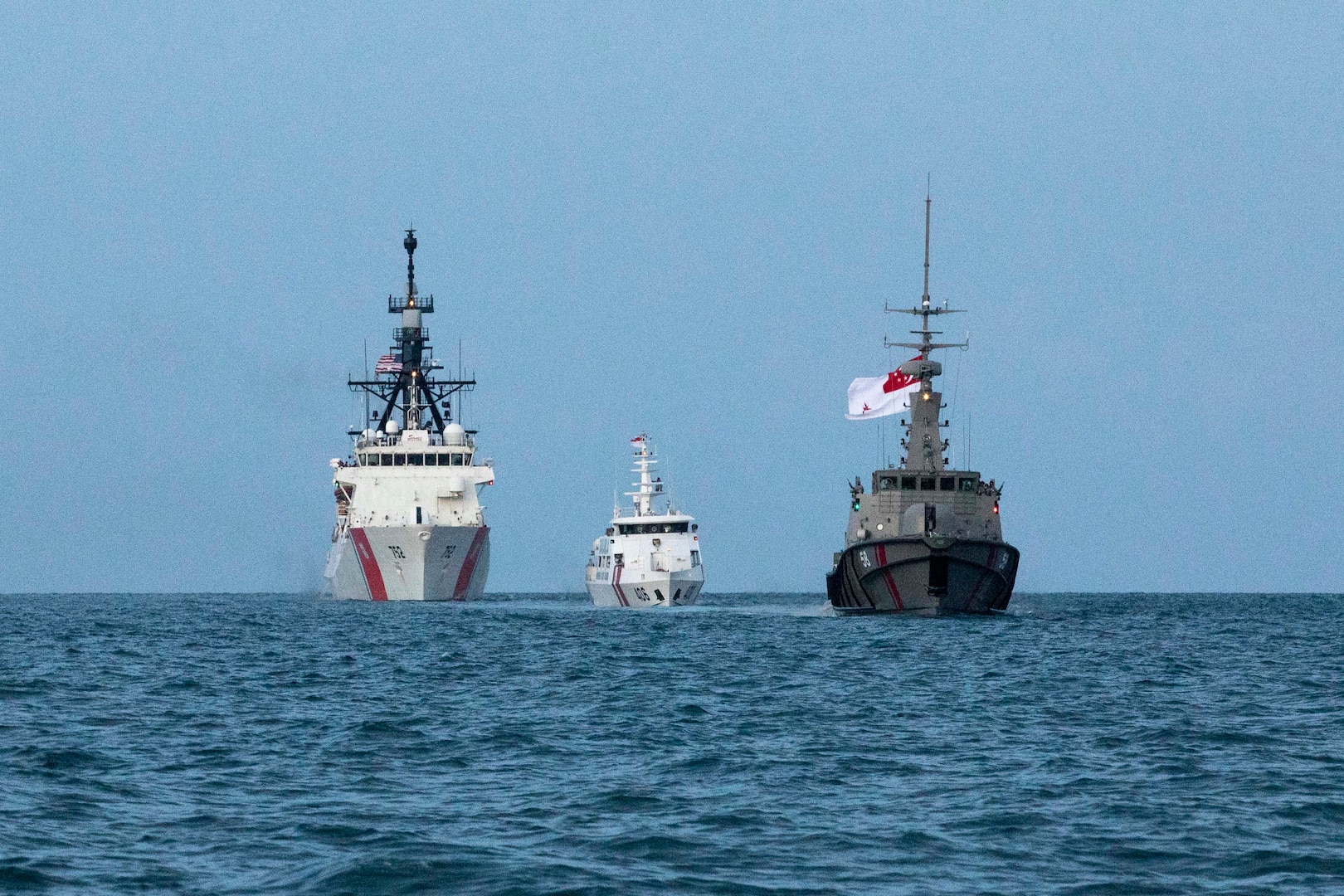 U.S. Coast Guard Cutter Stratton (WMSL 752) conducts passing exercises with the Indonesian Maritime Security Agency patrol boat KN Belut Laut-406 and Republic of Singapore Navy MSRV Bastion on May 22, 2023. Stratton deployed to the Western Pacific to conduct engagements with regional allies and partner nations, reinforcing rules-based order in the maritime domain. (U.S. Coast Guard photo by Chief Petty Officer Brett Cote)