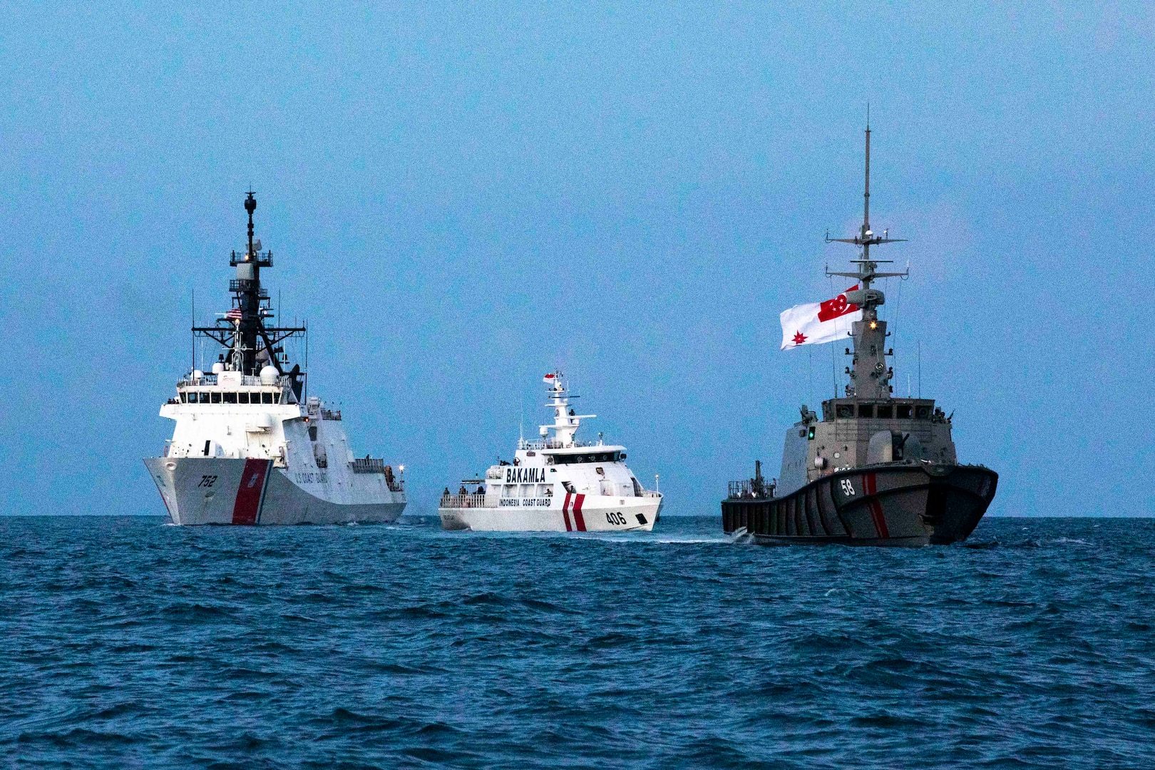 U.S. Coast Guard Cutter Stratton (WMSL 752) conducts passing exercises with Indonesian Maritime Security Agency patrol boat KN Belut Laut-406 and Republic of Singapore Navy MSRV Bastion on May 22, 2023. Stratton deployed to the Western Pacific to conduct engagements with regional allies and partner nations, to reinforce a rules-based order in the maritime domain. (U.S. Coast Guard photo by Chief Petty Officer Brett Cote)