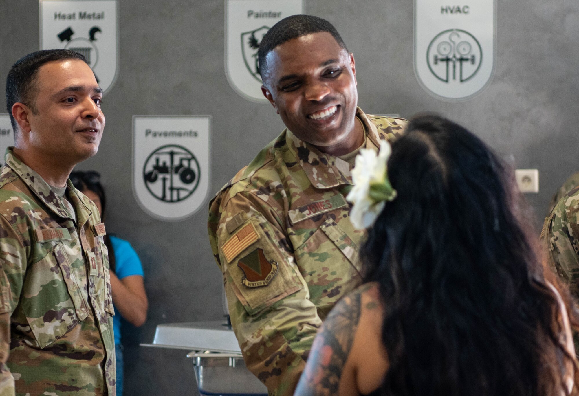 U.S. Air Force Brig. Gen. Otis C. Jones, 86th Airlift Wing commander, greets a performer at the Asian American and Pacific Islander Heritage Month closing ceremony at Ramstein Air Base, Germany