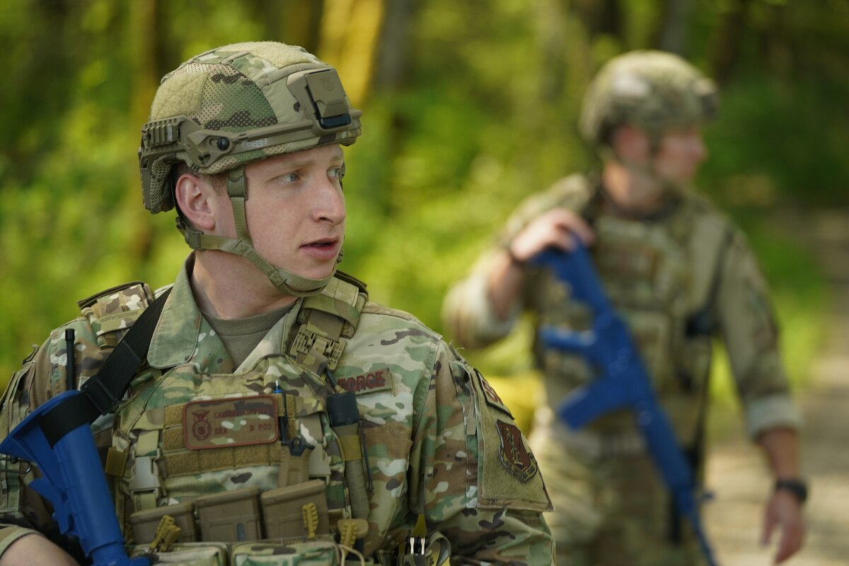 Senior Airman Cameron Ashworth, 194th Security Forces Squadron, patrols Camp Murray, Wash., during Exercise Phoenix Dawn May 9, 2023. The large-scale readiness exercise validated the wing’s ability to generate, employ and sustain combat power to combatant commanders.