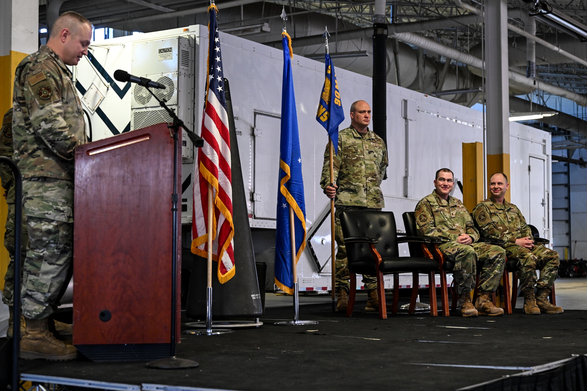 Col. Michael Power, 90th Maintenance Group commander, gives remarks during the 90th Munitions Squadron Change of Command Ceremony on F.E. Warren Air Force Base, Wyoming, May 30, 2023. A change of command represents a formal transfer of authority and responsibility from the outgoing commander to the incoming commander. (U.S. Air Force photo by Joseph Coslett Jr.)