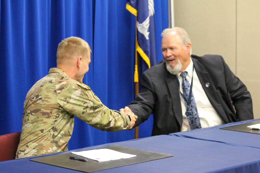 Signing, People, Feasibility Cost Share Ageement