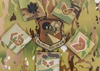collage of military patches on camo background