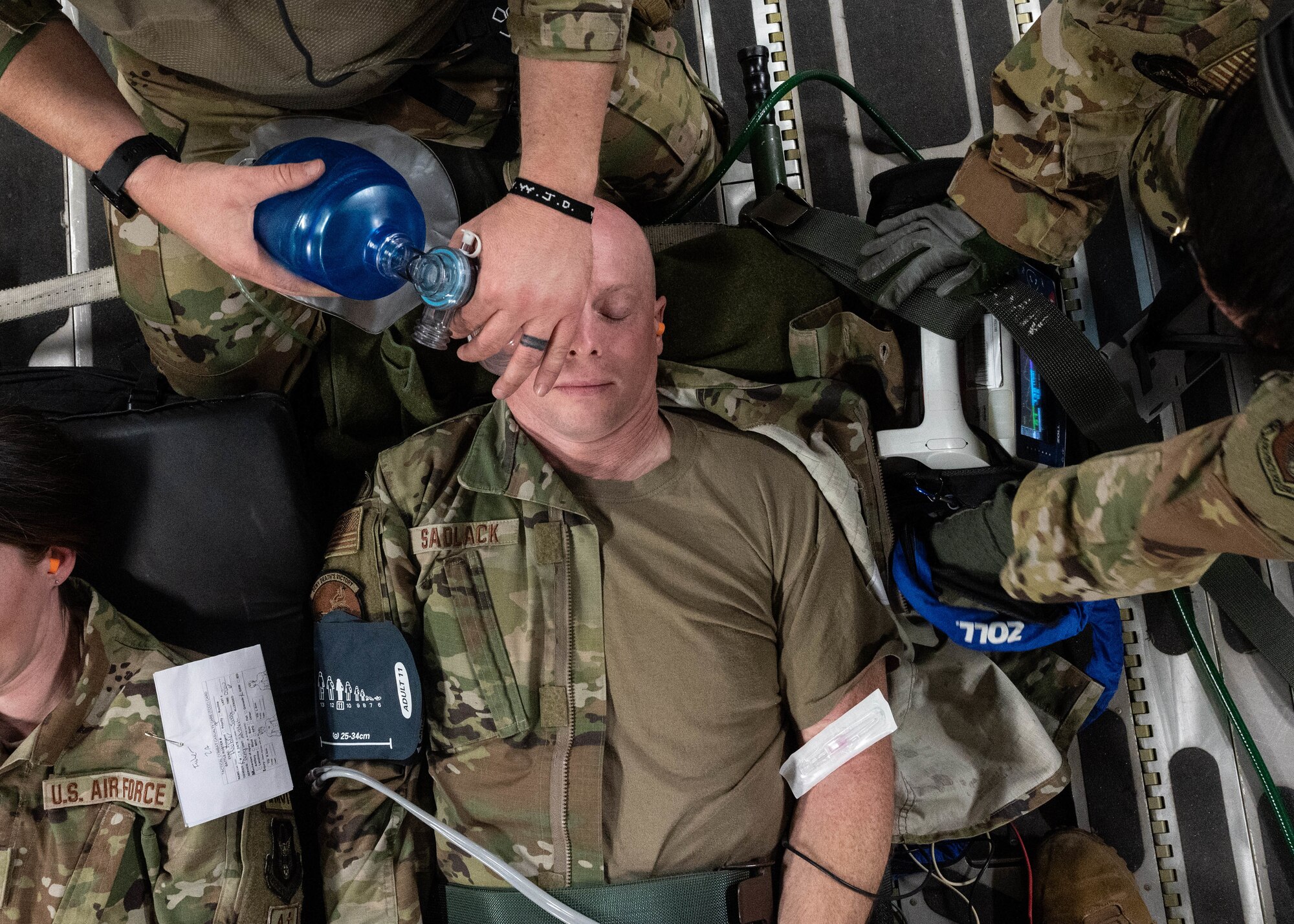 Capt. Loren Sadlack, a 934th Aeromedical Evacuation Squadron readiness officer, receives care as a simulated patient during a training exercise at the Minneapolis-St. Paul Air Reserve Station, May 5, 2023. Medically-trained Airmen were responsible for transferring, stabilizing and treating approximately 20 patients during the exercise. (U.S. Air Force photo by Senior Airman Victoriya Tarakanova)