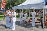CAPT Walter D. Brafford (2nd from right), incoming commander, salutes during the National Anthem with Rear Adm. Cynthia A. Kuehner (2nd from left), Rear Adm. Anne Swap (left) and Army Lt. Gen. John P. Evans Jr.