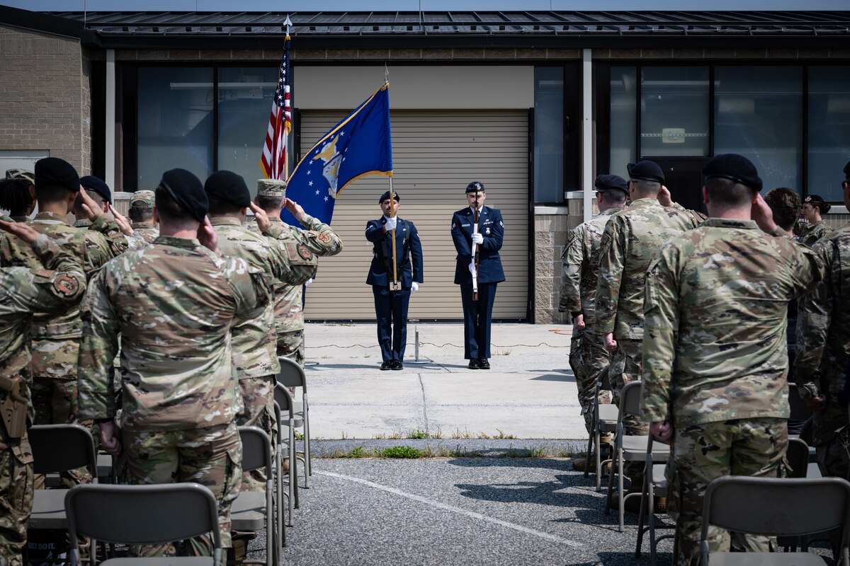 Airmen assigned to the 436th Security Forces Squadron salute the United States flag at the 2023 Police Week opening ceremony at Dover Air Force Base, Delaware, May 22, 2023. In recognition of Police Week, the 436th SFS held a ruck, excellence in competition event, Defender’s Challenge and a golf tournament. Police Week recognizes fallen law enforcement officers, including security forces members. (U.S. Air Force photo by Staff Sgt. Marco Gomez)