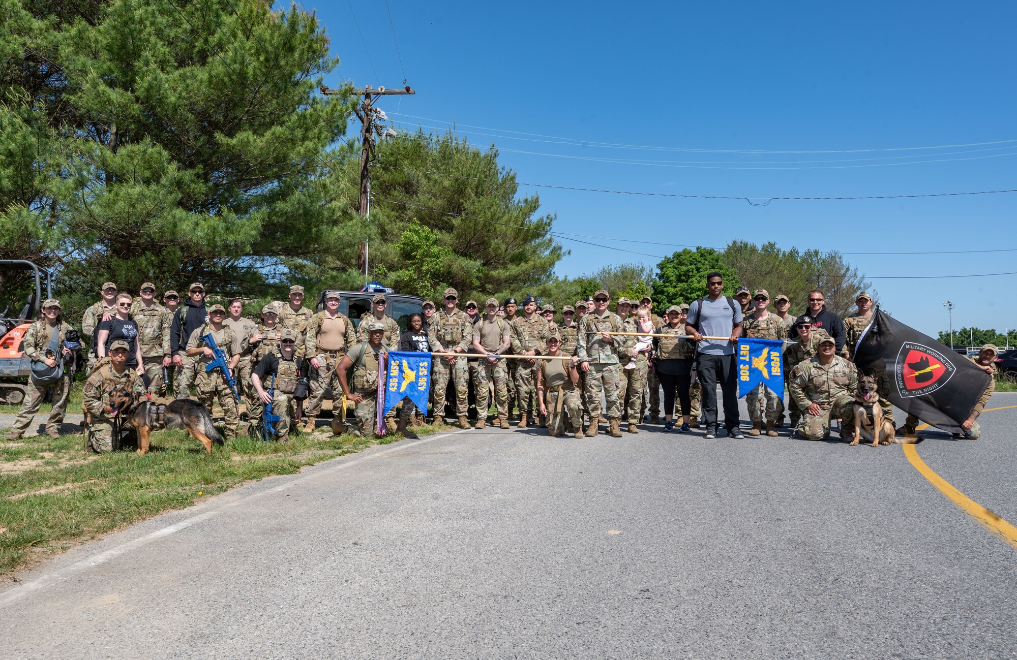 Team Dover Airmen pose for a photo following the 2023 Police Week Ruck at Dover Air Force Base, Delaware, May 25, 2023. In recognition of Police Week, the 436th Security Forces Squadron held a ruck, excellence in competition event, Defender’s Challenge and a golf tournament. Police Week recognizes fallen law enforcement officers, including security forces members. (U.S. Air Force photo by Senior Airman Cydney Lee)