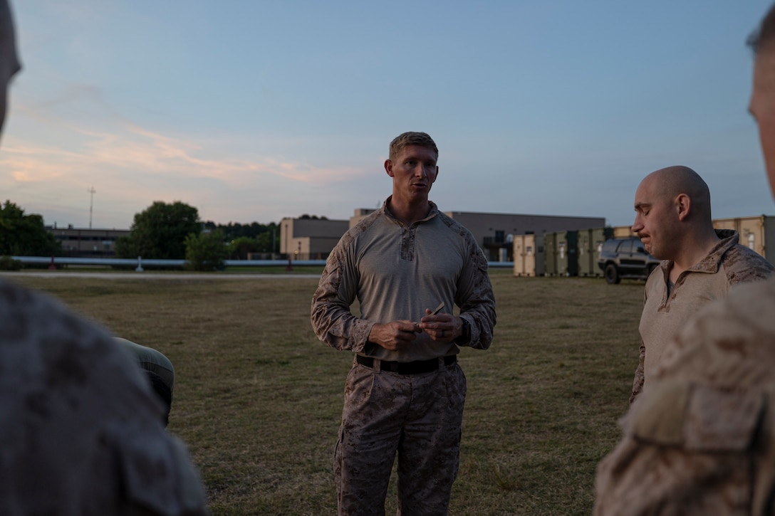 U.S. Marine Corps Gunnery Sgt. Dayton McConnell, a platoon sergeant with the Maritime Special Purpose Force, 26th Marine Expeditionary Unit, speaks to Marines in his platoon prior to conducting a raid during Exercise Trident 23-4 at Joint Expeditionary Base Little Creek-Fort Story, Virginia, May 20, 2023.