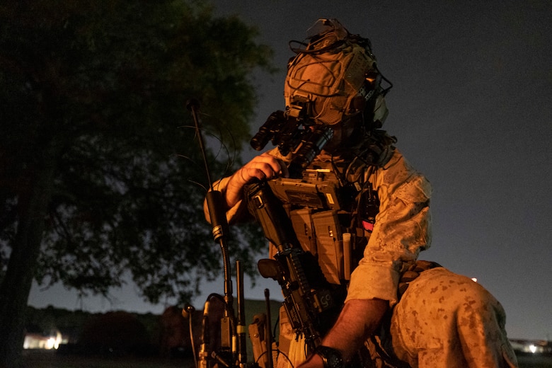 A U.S. Marine with the 26th Marine Expeditionary Unit’s (MEU) Maritime Special Purpose Force sets up communications prior to conducting a raid during Exercise Trident 23-4 at Joint Expeditionary Base Little Creek-Fort Story, Virginia, May 20, 2023.