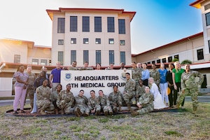 Members of the 6th Medical Group Mental Health clinic pose for a group photo at MacDill Air Force Base, Florida, May 10, 2023. The clinic is comprised of 40 highly trained providers and support staff who are skilled in a variety of specialties, including licensed clinical social workers, certified drug and alcohol counselors, psychiatrists, phycologists, case managers, mental health technicians and administrative staff. (U.S. Air Force photo by Senior Airman Lauren Cobin)