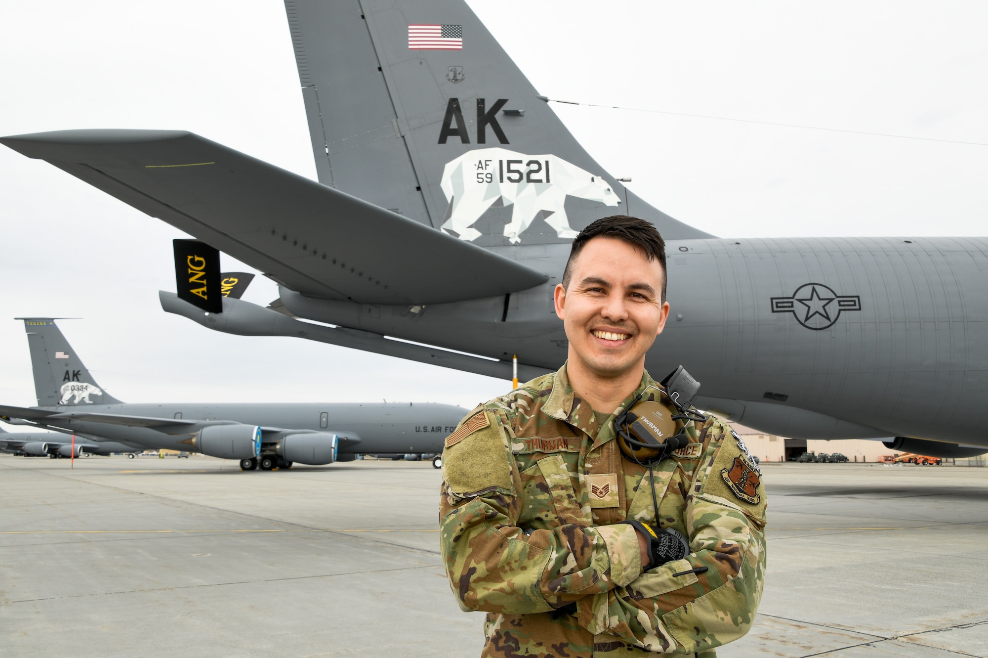 Staff Sgt. David Thurman, a crew chief with the 168th Wing, Alaska Air National Guard, poses for a photo in front of a 168th Wing KC-135 Stratotanker at Eielson Air Force Base. The Alaska Air National Guard KC-135s provide air refueling, joint force lethality, and deter aggression across the Pacific. (U.S. Air National Guard photo by Senior Master Sgt. Julie Avey)