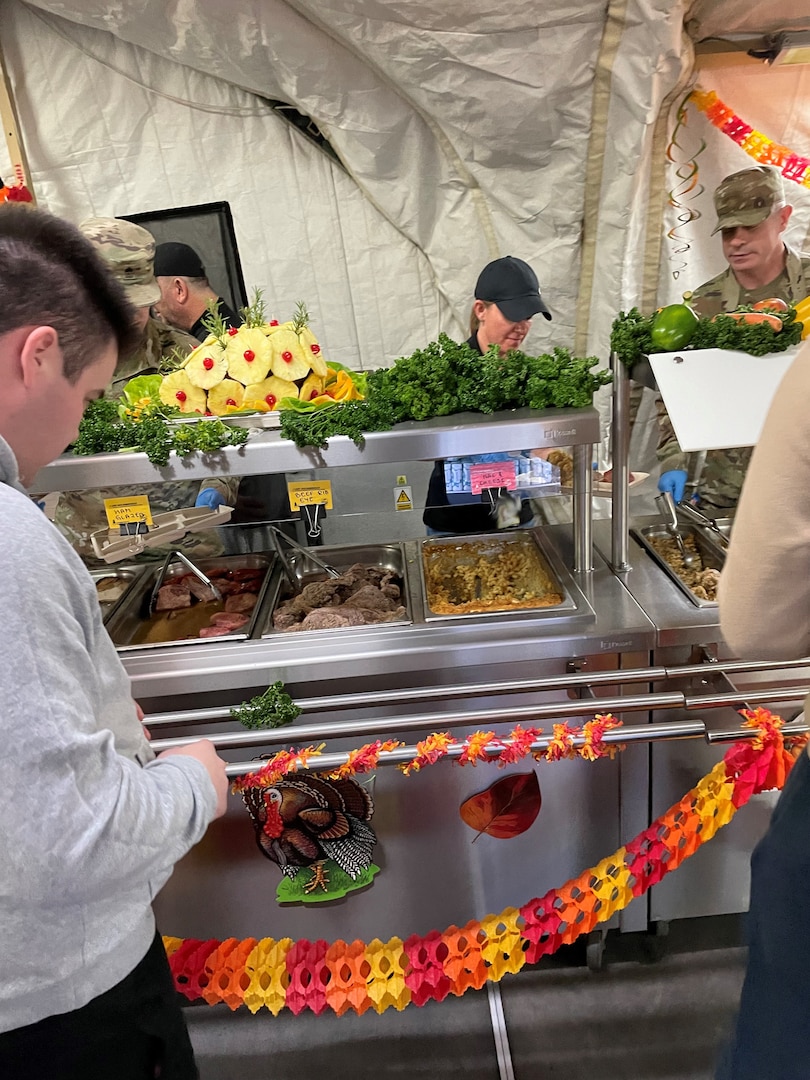 Dawn Gettys, then-liaison officer for Defense Logistics Agency Support Team – North, along with fellow DST – North members, serve Thanksgiving dinner to troops in Powidz, Poland. Gettys served on DST – North from October 2022 – March 2023 as part of the DLA Land and Maritime Civilian Deployment Program.