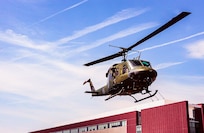 helicopter flying over building