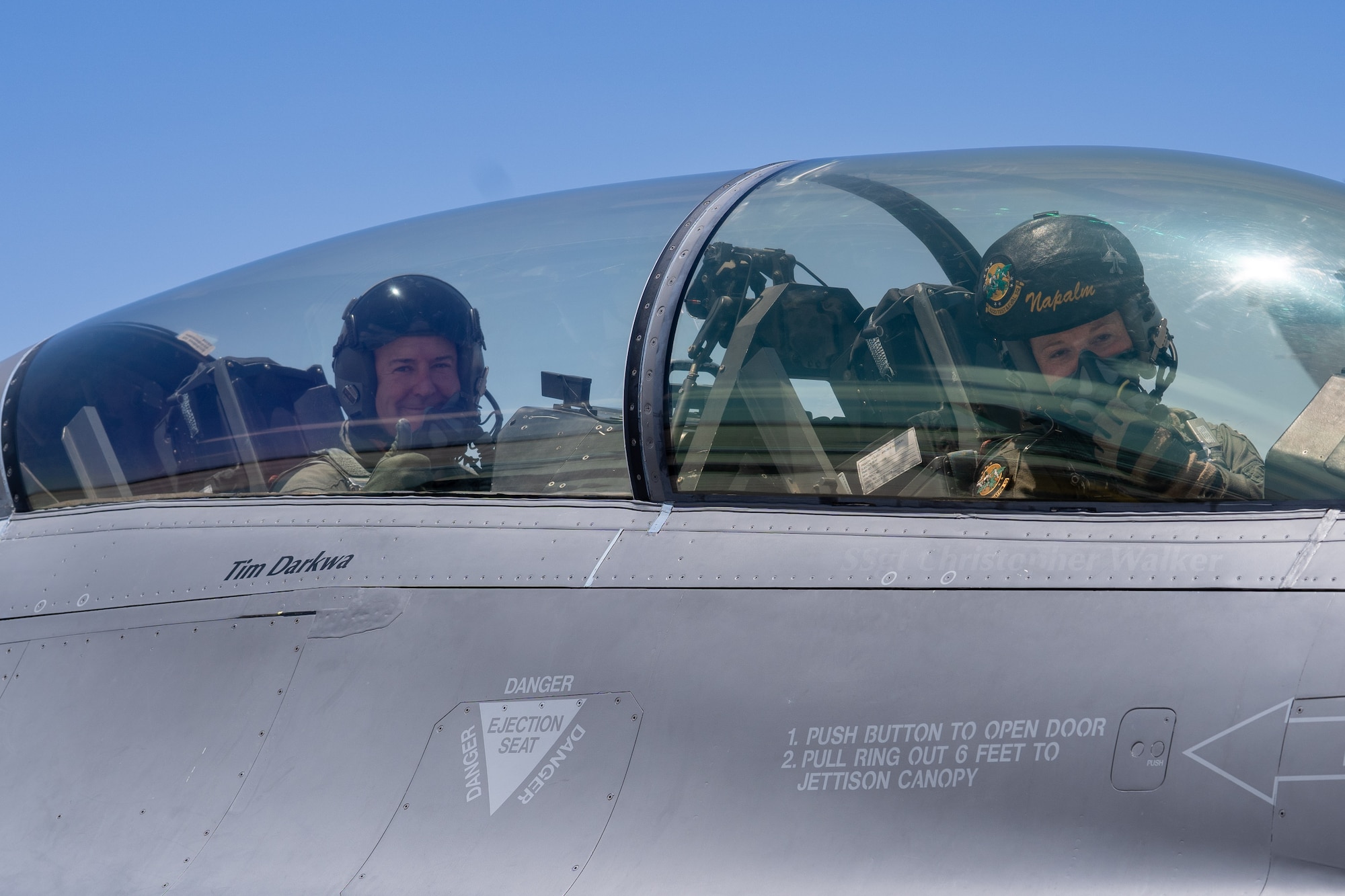 Mr. Rob McHenry, the Deputy Director of the Defense Advanced Research Projects Agency (DARPA), left, and U.S. Air Force Maj. Megan Hainline, a pilot assigned to the 422 Test and Evaluations Squadron, sit in an F-16D Fighting Falcon at Nellis Air Force Base, Nevada, May 24, 2023.