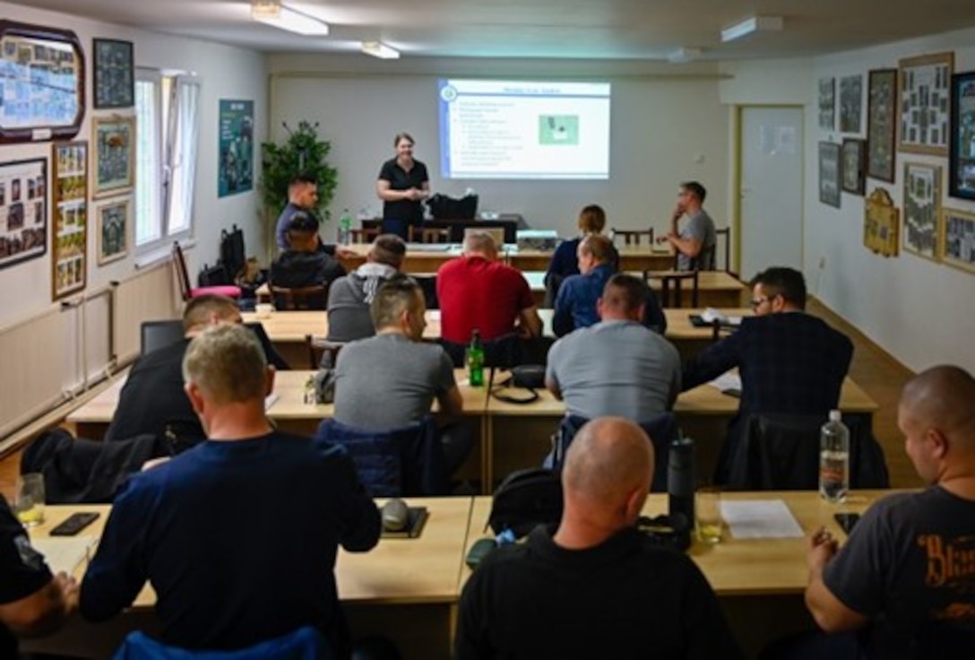 Special Agent Emily Leggett, OSI 4th Field Investigations Squadron Forensic Science Consultant, leads a discussion on the initial steps of investigating various crimes during the first day of a two-day subject matter expert information exchange in Hronsek, Slovakia, April 24, 2023. The event brought together OSI and military police from Eastern European nations, including Slovakia and the Czech Republic. (U.S. Air Force photo by Thomas Brading, OSI/PA)