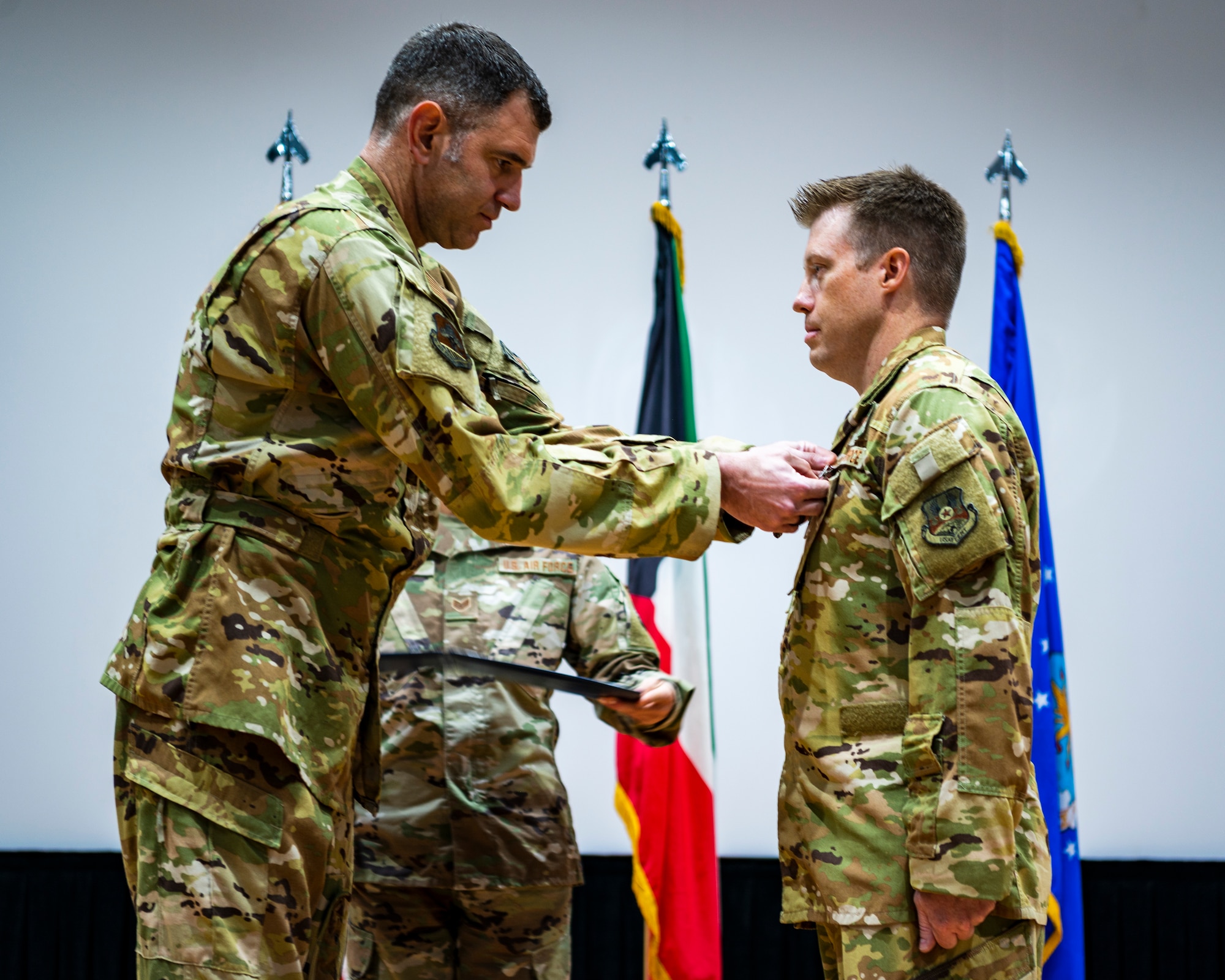 U.S. Air Force members participate in a change of command ceremony.