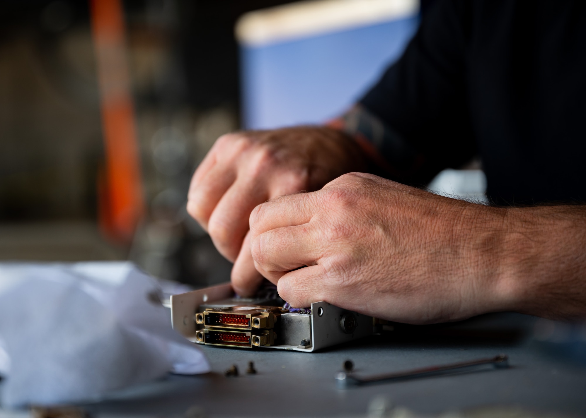 Brian Rollefson, Lockheed Martin F-16 electrical technician, cuts and replaces wires as part of the radar modification upgrade process to the 20th Fighter Wing (FW) F-16 fleet at Shaw Air Force Base, S.C., April 19, 2023. These modification upgrades utilize the advanced radar equipment that is standard for 5th generation aircraft, ensuring 20th FW aircraft are ready for tomorrow’s missions, today. (U.S. Air Force photo by Airman 1st Class Erin Stanley)