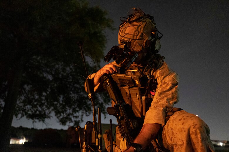 A U.S. Marine with the 26th Marine Expeditionary Unit’s (MEU) Maritime Special Purpose Force sets up communications prior to conducting a raid during Exercise Trident 23-4 at Joint Expeditionary Base Little Creek-Fort Story, Virginia, May 20, 2023.