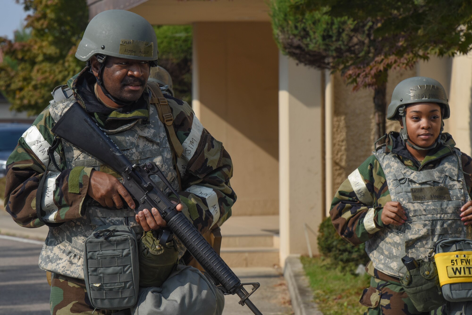U.S. Air Force Tech. Sgt. Alton Kelly, 51st Fighter Wing post attack reconnaissance team member, left, and Master Sgt. Taylor Marcedes, 51st FW inspection team member, scan for simulated unexploded ordinance during Vigilant Defense 24 at Osan Air Base, Republic of Korea, Oct. 31, 2023. The Airmen of the 51st FW continuously train to maintain the high level of full-spectrum readiness required to execute the mission proficiently and effectively. VD24 is a routine training event that tests the military capabilities across the peninsula, allowing combined and joint training at both the operational and tactical levels. (U.S. Air Force photo by Airman 1st Class Chase Verzaal)