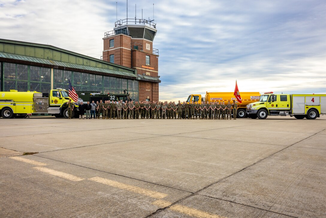 U.S. Marines with Marine Corps Air Facility take a group photo after a post and relief ceremony on Marine Corps Base Quantico, Virginia, Oct. 31, 2023. The post and relief ceremony transferred responsibilities from U.S. Marine Corps Master Gunnery Sgt. Tyler Corwin, former senior enlisted advisor, MCAF, to 1st Sgt. Brandon Smart. (U.S. Marine Corps photo by Lance Cpl. Joaquin Dela Torre)