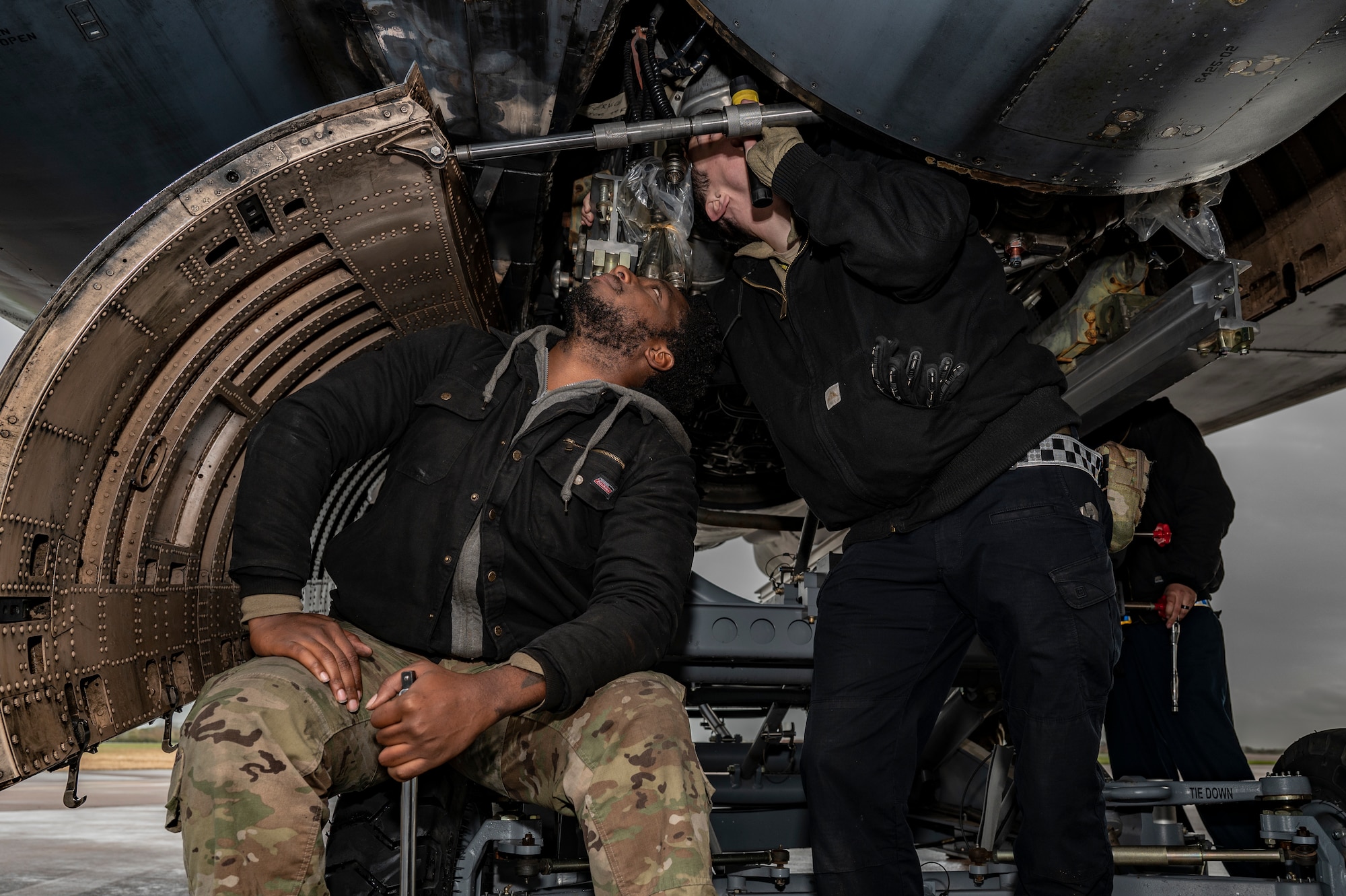 Staff Sgt. Thomas Marbut, 9th Expeditionary Bomb Squadron deployed engine manager and Tech Sgt. Brice Wilkerson, 9th EBS crew chief, perform a rapid engine change at RAF Fairford, United Kingdom, Nov. 1, 2023. Bomber Task Force missions enable crews to maintain a high state of readiness and proficiency, validating our always-ready, global strike capability. (U.S. Air Force Photo by Senior Airman Ryan Hayman)