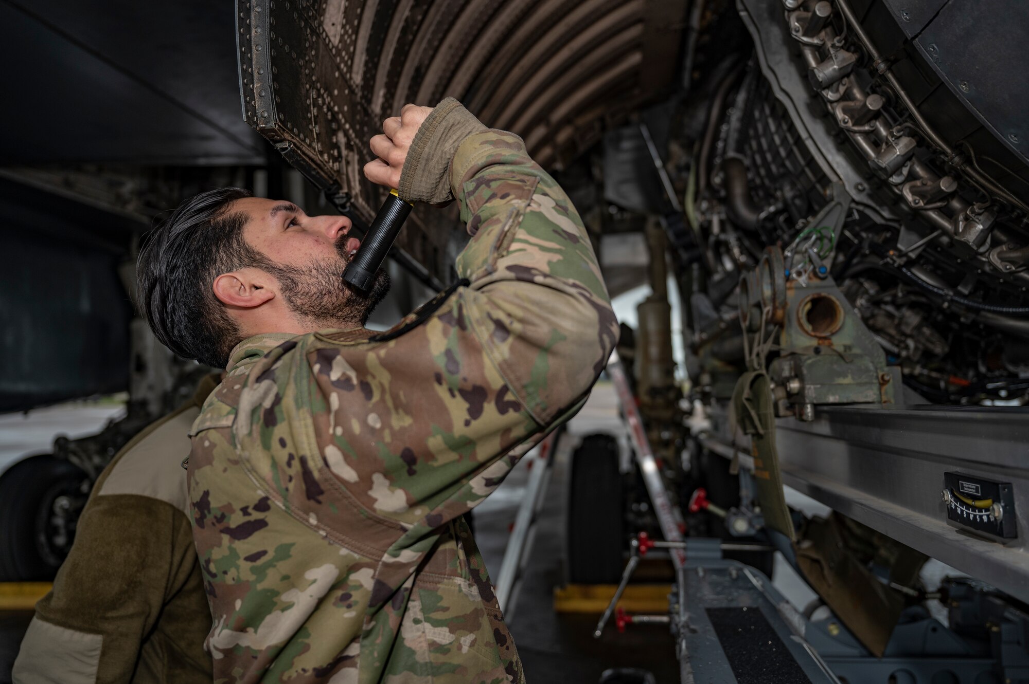 Staff Sgt. Michael Souquette, 9th Expeditionary Bomb Squadron jet engine NCO in charge, performs a rapid engine change at RAF Fairford, United Kingdom, Nov. 1, 2023. The U.S. Air Force routinely deploys a variety of aircraft and units throughout Europe for training and to support geographic combatant command objectives. (U.S. Air Force Photo by Senior Airman Ryan Hayman)