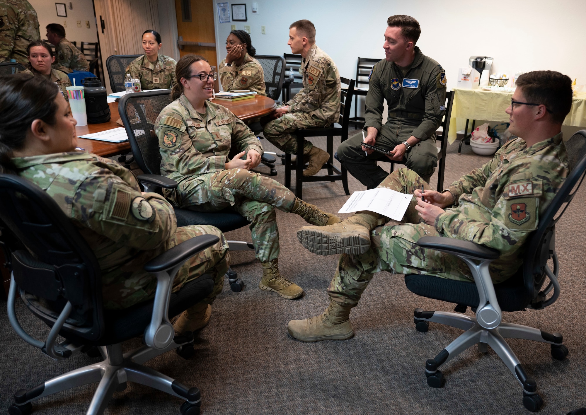 Senior noncommissioned officers and company-grade officers participate in small group discussions during a flight leadership course at Holloman Air Force Base, New Mexico, Oct. 26, 2023. The flight leadership course helps prepare individuals who are either stepping into flight leadership roles or already filling one. (U.S. Air Force photo by Airman 1st Class Michelle Ferrari)