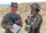 Sgt 1st Class Zachary Harrison, an event planner for the 2023 Medical Readiness Command-West Best Medic Competition, provides details of an event to a Best Medic Competitor. Harrison is assigned to the Evans Army Community Hospital Radiology Department.