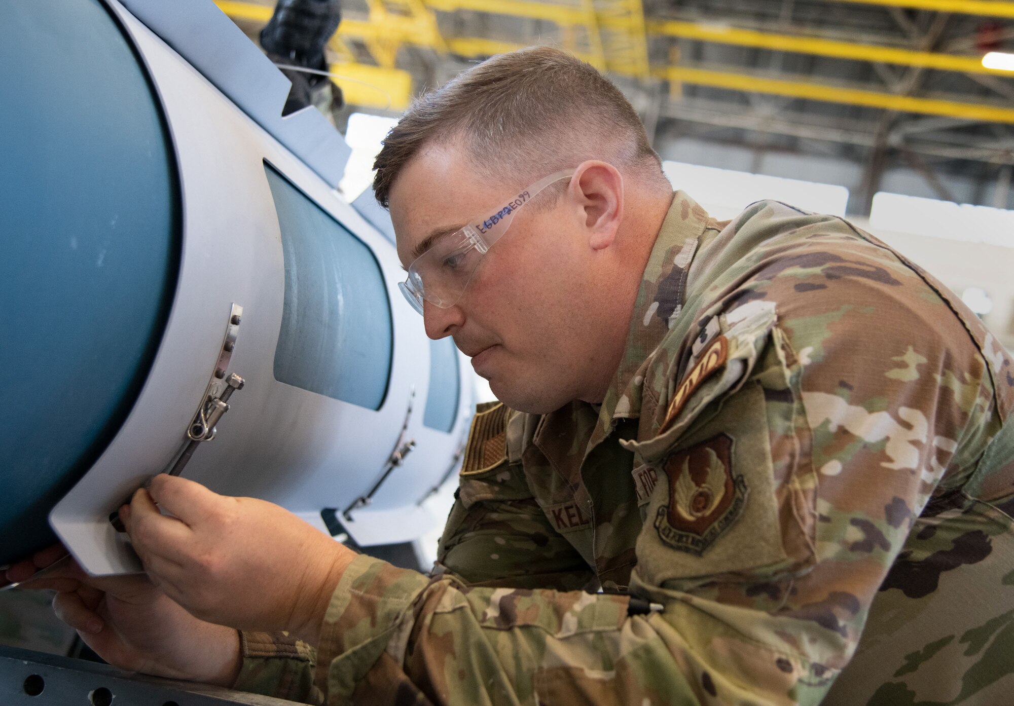 An Airman races to build a GBU-31.