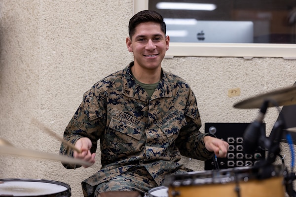 U.S. Marine Corps Cpl. Ezequiel E. Gonzalez, a percussionist with the 2nd Marine Aircraft Wing (MAW) Band, poses for a photo at Marine Corps Air Station Cherry Point, North Carolina, Dec. 22, 2022. 2nd MAW is the aviation combat element of II Marine Expeditionary Force. (U.S. Marine Corps photo by Lance Cpl. Elias E. Pimentel III)