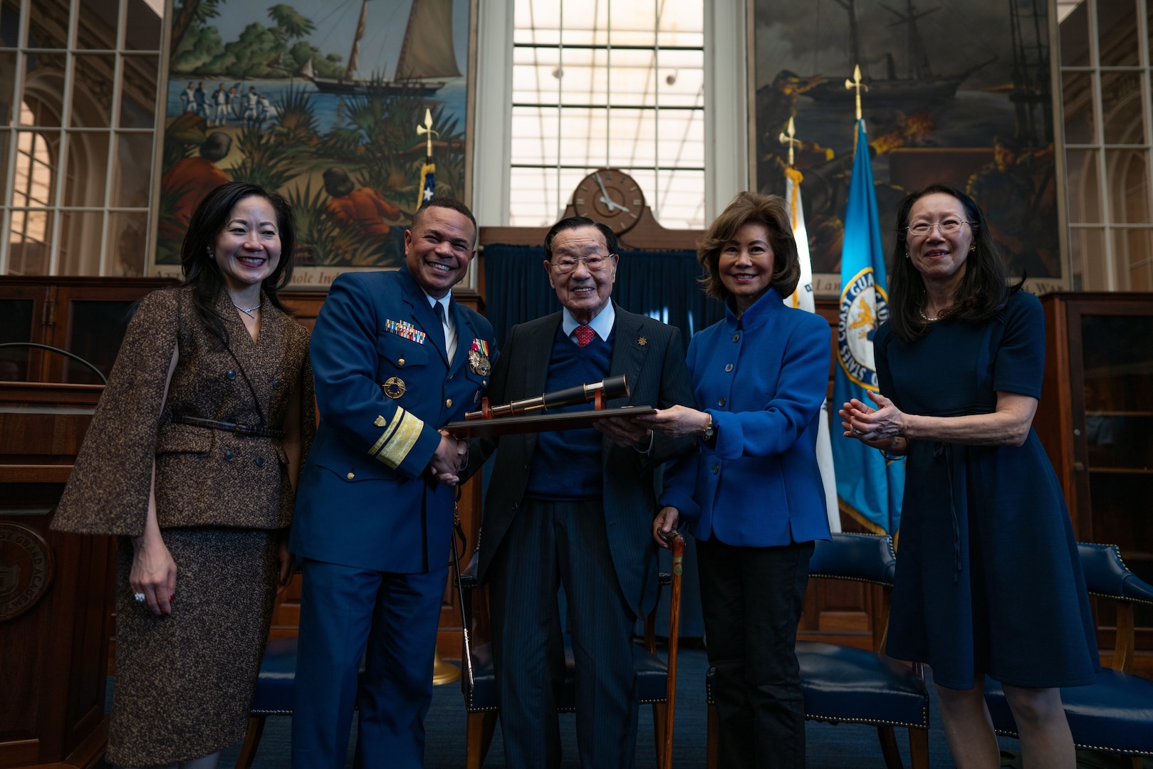 The U.S. Coast Guard Academy recognized Dr. James Chao as the first recipient of the newly established Scientæ Cedit Mare Award in New London, 27 Oct. 2023. Dr. Chao accepted the award with his family, the Honorable Elaine Chao, her sisters May and Angela, and grandson James. (Coast Guard photograph by Petty Officer 3rd Class Matt Thieme)