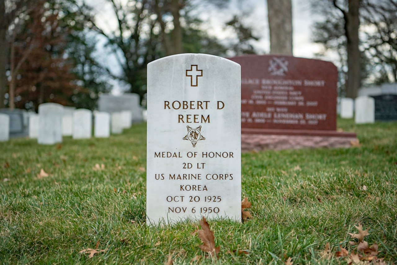 A grave marker shows the name “Robert D. Reem.”