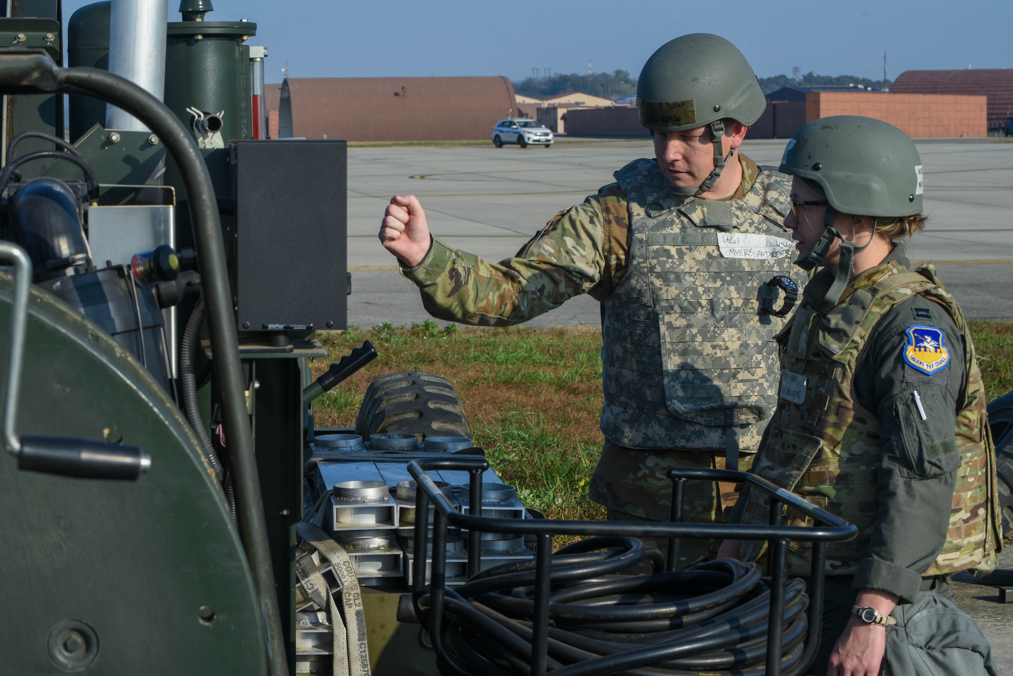 Lt Col. Andrew Myers, 51st Civil Engineer Squadron commander, and Capt. Miki Mullen, 51st Operations Support Squadron director of staff, oversees as an alternate landing strip is activated during Vigilant Defense 24 at Osan Air Base, Republic of Korea, Oct. 29, 2023. The ALS is a contingency to losing operational function of Osan’s main runways. This reallocation of flightline space allows pilots to continue operating even with damaged runways. VD24 is a routine training event that tests the military capabilities across the peninsula, allowing combined and joint training at both the operational and tactical levels. (U.S. Air Force photo by Airman 1st Class Chase Verzaal)