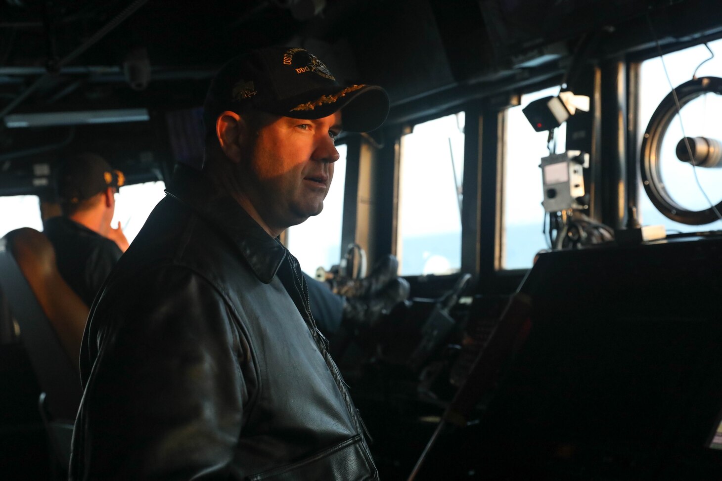 231102-N-CV021-1079 TAIWAN STRAIT (Nov. 2, 2023) Commanding Officer Cmdr. Charles Cooper stands watch on the bridge aboard the Arleigh Burke-class guided-missile destroyer USS Rafael Peralta (DDG 115) in the Taiwan Strait, Nov. 2. Rafael Peralta is forward-deployed and assigned to Commander, Task Force 71/Destroyer Squadron (DESRON) 15, the Navy’s largest DESRON and the U.S. 7th Fleet’s principal surface force. (U.S. Navy photo by Mass Communication Specialist 3rd Class Alexandria Esteban)