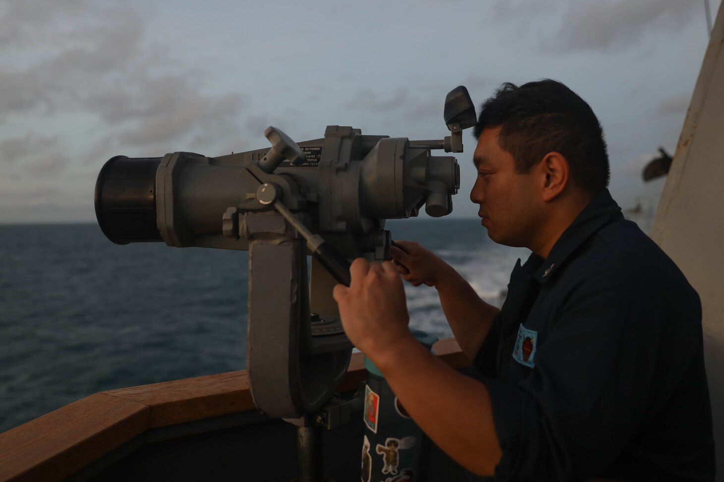 231102-N-CV021-1054 TAIWAN STRAIT (Nov. 2, 2023) Sonar Technician Surface 3rd Class John Valor, from Chicago, stands watch on the bridge aboard the Arleigh Burke-class guided-missile destroyer USS Rafael Peralta (DDG 115) in the Taiwan Strait, Nov. 2. Rafael Peralta is forward-deployed and assigned to Commander, Task Force 71/Destroyer Squadron (DESRON) 15, the Navy’s largest DESRON and the U.S. 7th Fleet’s principal surface force. (U.S. Navy photo by Mass Communication Specialist 3rd Class Alexandria Esteban)