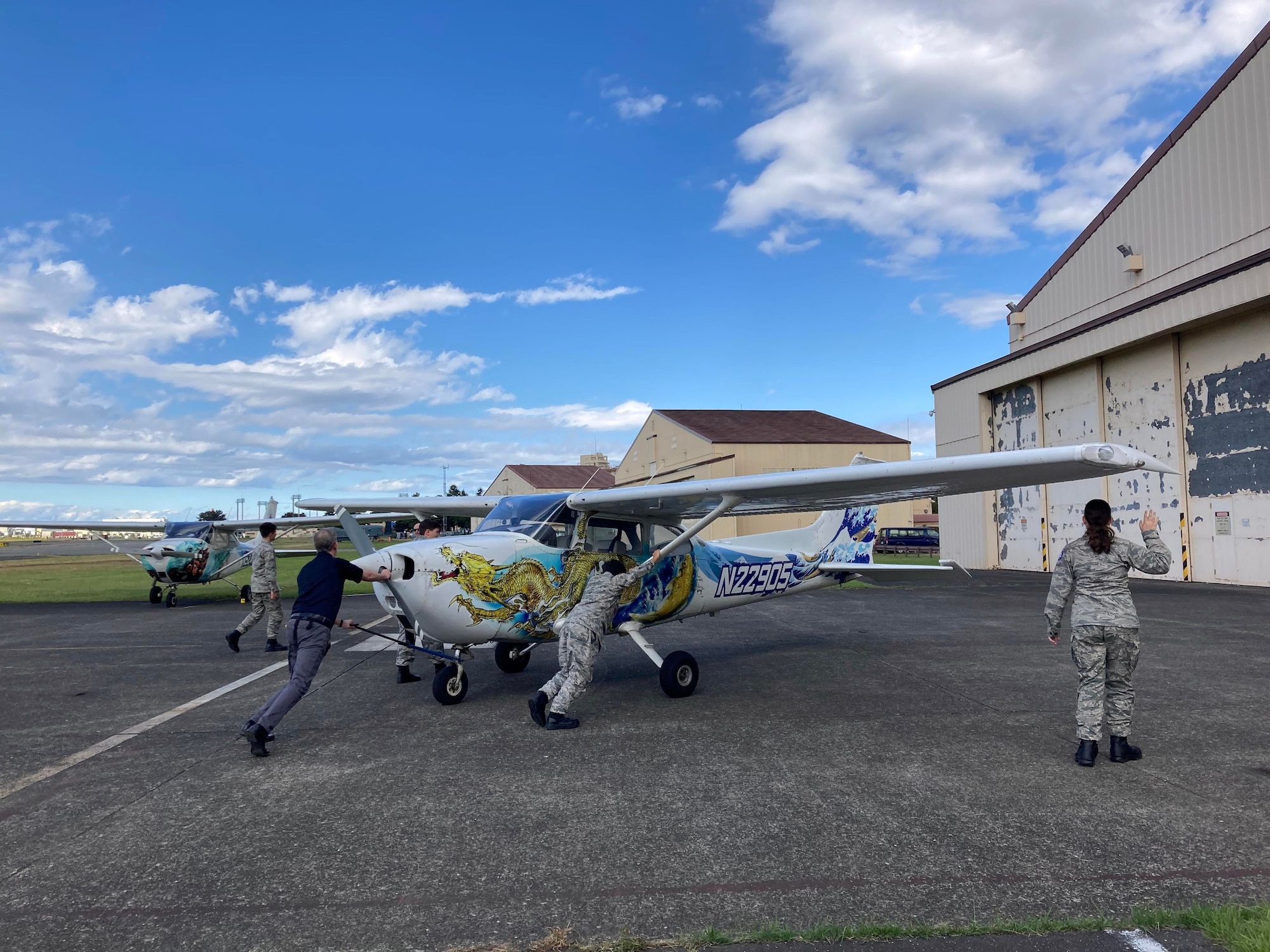 Misawa Air Base Civil Air Patrol cadets learn about aircraft towing operations during a Civil Air Patrol Orientation Flight at Yokota Flight Training Center, Japan, Oct. 20-22, 2023.