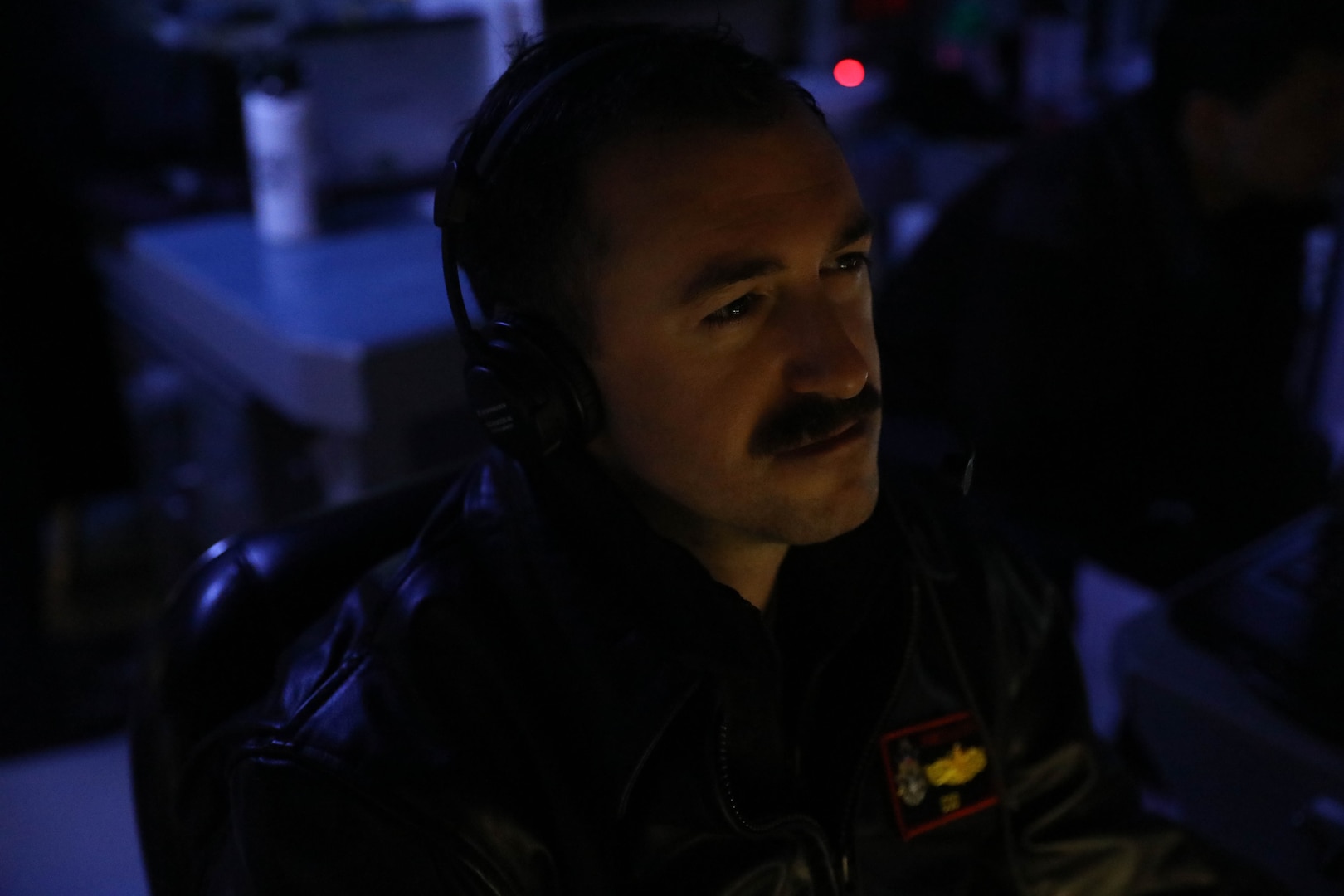 231102-N-CV021-1046 TAIWAN STRAIT (Nov. 2, 2023) Lt. Zachary Northcutt, from Palm Harbor, Florida, stands watch in the combat information center aboard the Arleigh Burke-class guided-missile destroyer USS Rafael Peralta (DDG 115) in the Taiwan Strait, Nov. 2. Rafael Peralta is forward-deployed and assigned to Commander, Task Force 71/Destroyer Squadron (DESRON) 15, the Navy’s largest DESRON and the U.S. 7th Fleet’s principal surface force. (U.S. Navy photo by Mass Communication Specialist 3rd Class Alexandria Esteban)