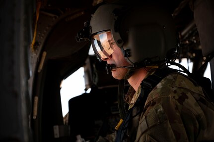 close up of a flight engineer in a helicopter