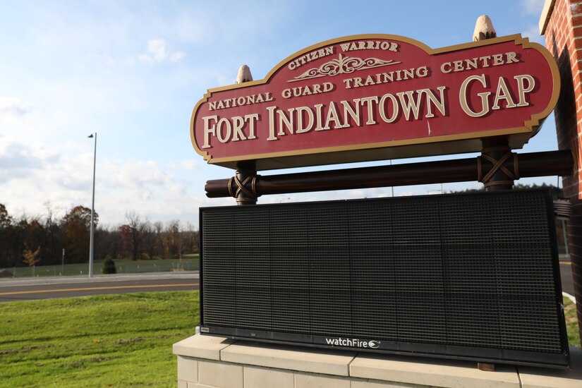 U.S. Soldiers and Airmen with the Pennsylvania National Guard, as well as civilians and community partners, attend a dedication ceremony for the newly constructed main access control point at Fort Indiantown Gap, Nov. 1, 2023.