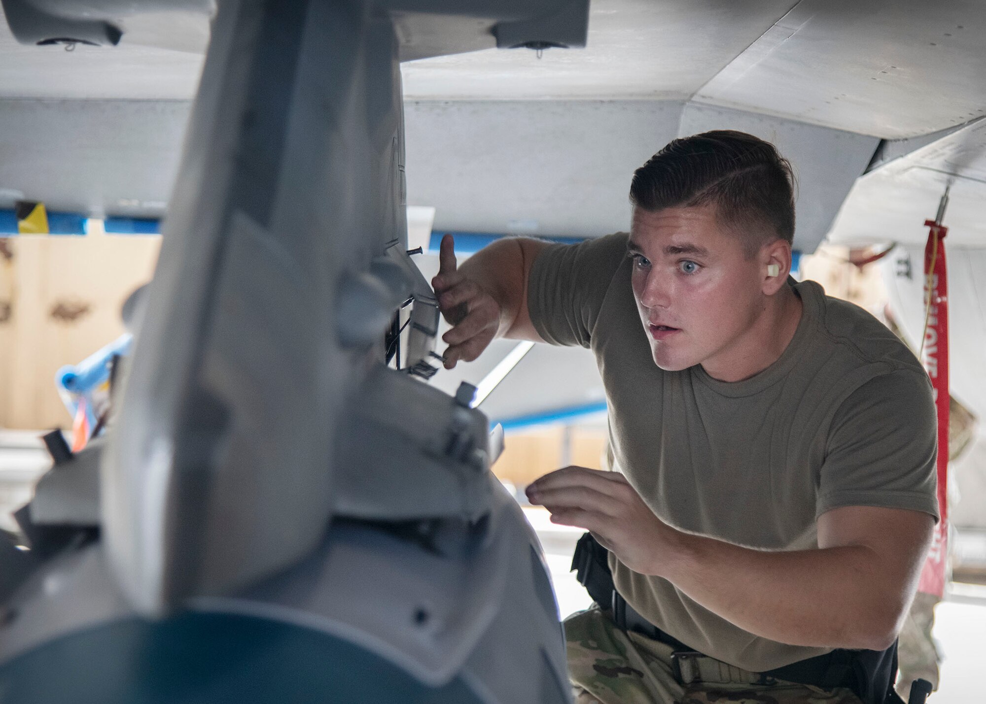 An Airman rushes to finalize pre-load procedures on an F-16 Falcon.
