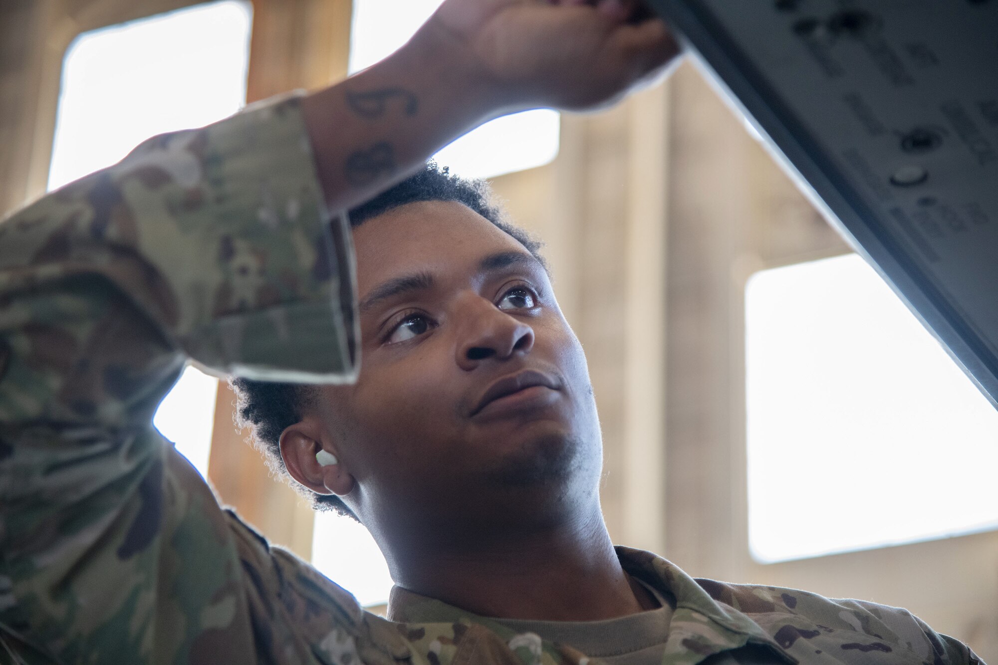 An Airman performs pre-load procedures on an F-16 Fighting Falcon.