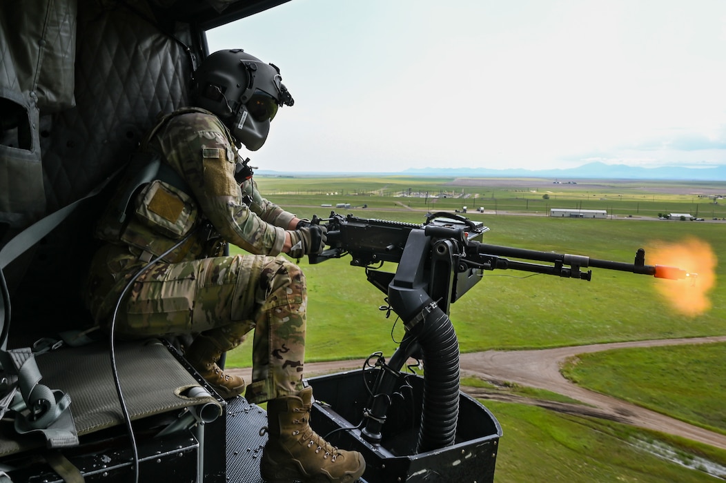 Airman 1st Class Keera Nickodem, 40th Helicopter Squadron flight engineer, shoots an M240 machine gun out of a UH-1N Huey at Malmstrom Air Force Base, Mont., June 28, 2023. The 40th HS began as Detachment 5 of the 37th Air Rescue and Recovery Squadron and was one of seven detachments in the 37th ARRS under Military Airlift Command. (U.S. Air Force photo by Airman 1st Class Breanna Christopher Volkmar)