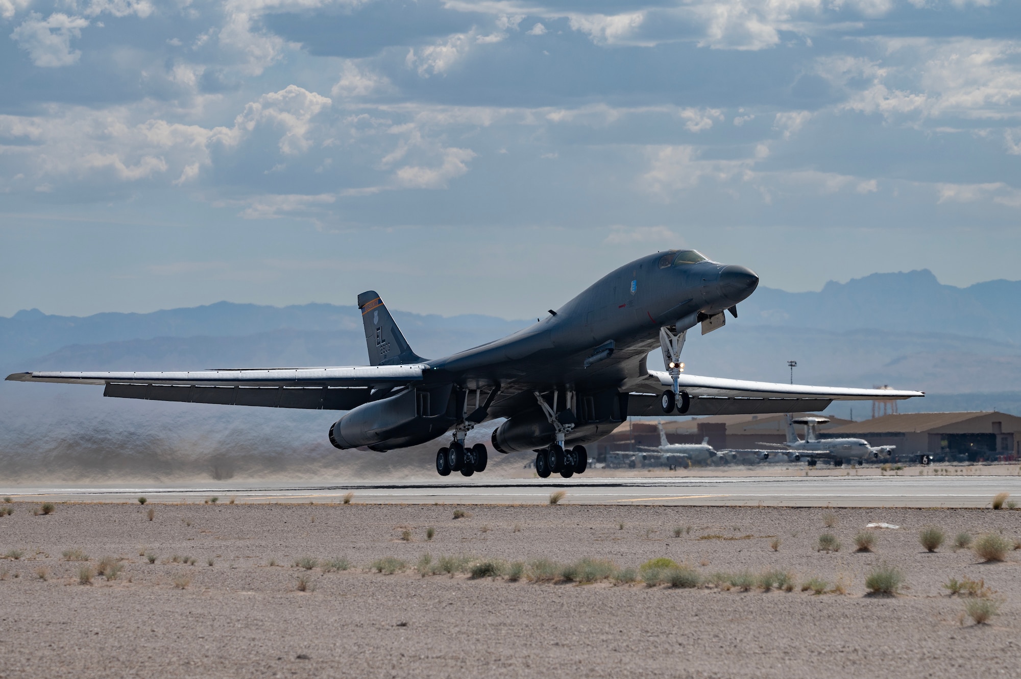 A B-1B Lancer takes off for a Weapons School Integration (WSINT) mission at Nellis Air Force Base, Nevada, May 30, 2023.The Weapons School provides personnel further exposure into a joint environment to ensure readiness and increase lethality. (U.S. Air Force photo by William Lewis)