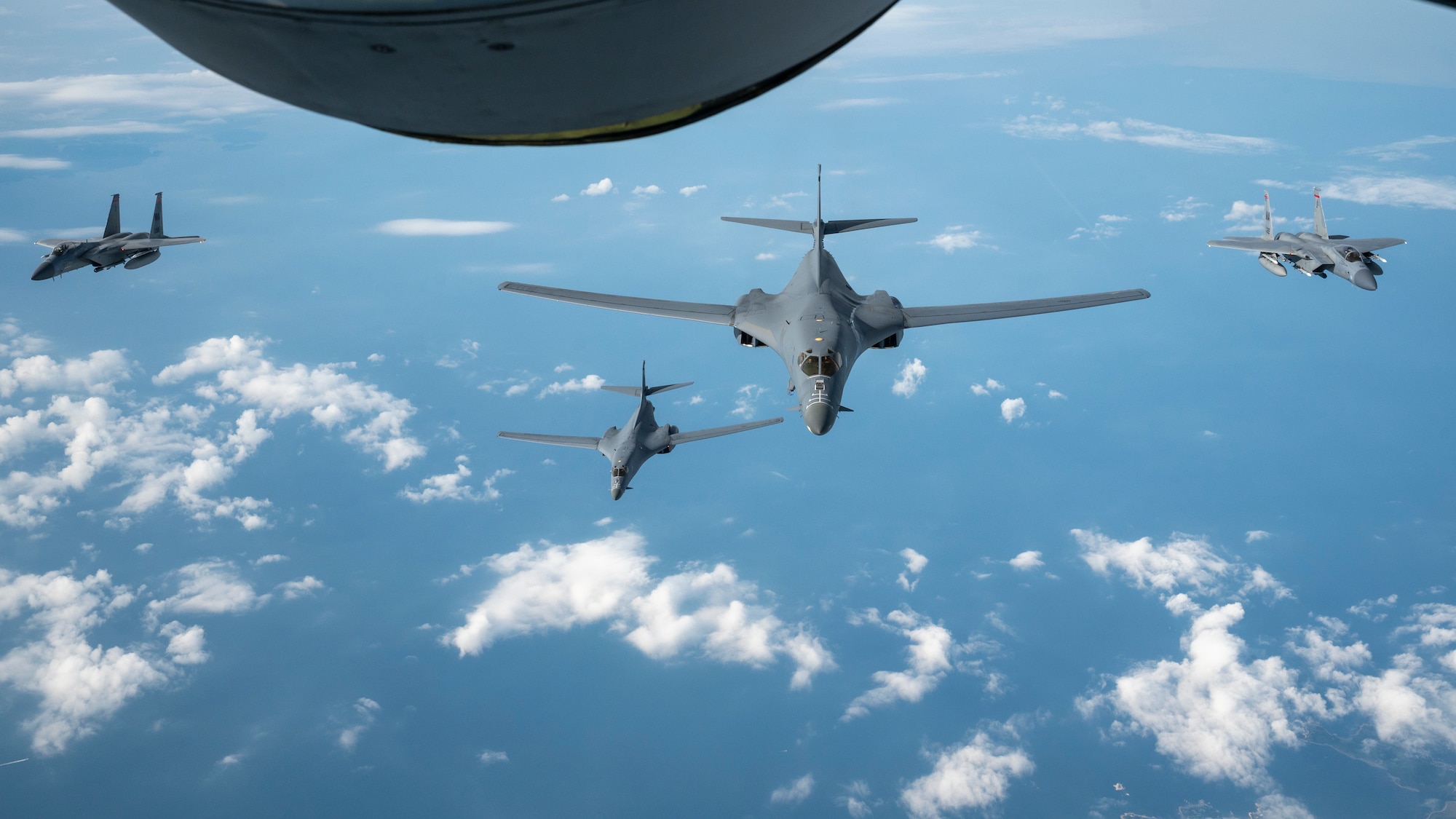 NORAD aircraft from both the Canadian and Continental U.S. regions intercept two B-1 Lancer bombers as they entered Air Defense Identification Zone off the east coast of North America during air-defense Operation NOBLE DEFENDER, June 26, 2023. NORAD units executed maneuvers designed to defend the eastern approach of North America from simulated cruise missile threats in this particular operation. CF-18 aircraft from the Canadian NORAD Region, F-15C and KC-135 aircraft from the Continental U.S. NORAD Region, and B-1s from U.S. Strategic Command all participated in the operation. NORAD conducts sustained and dispersed operations under OND to validate the missions of aerospace warning, aerospace control and maritime warning. (U.S. Air National Guard photo by Master Sgt. Bryan Hoover)