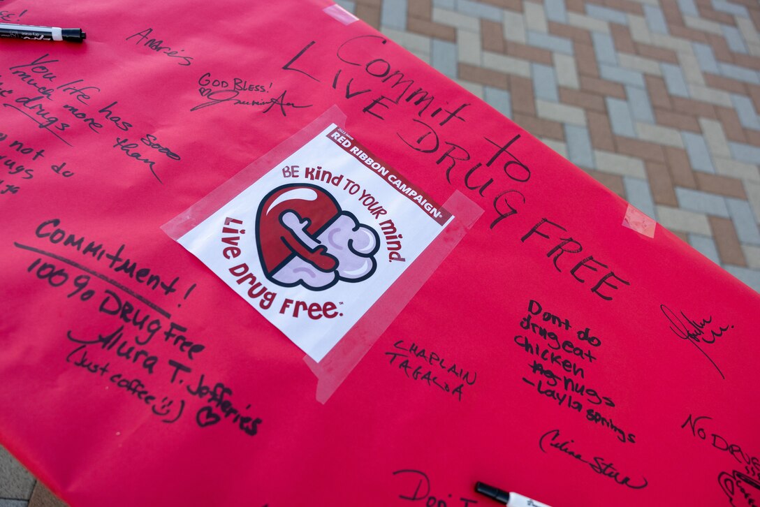 A drug-free banner is displayed during the Red-Ribbon Week 2023 event at Marine Corps Air Station Iwakuni, Japan, Oct. 30, 2023. Red-Ribbon Week highlights the importance of living a drug-free life and gives educators and other community leaders the opportunity to reinforce drug-free messages with students and children. (U.S. Marine Corps Photo by Cpl. Calah Thompson)