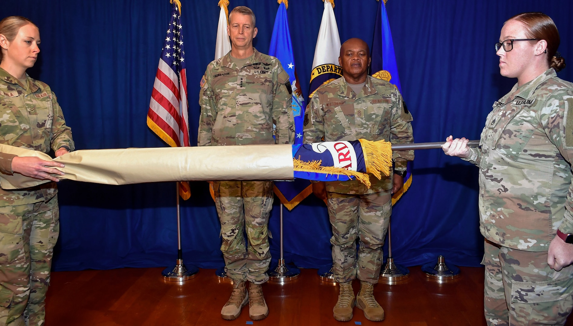 Army Gen. Daniel Hokanson, chief of the National Guard Bureau, presents the positional colors to Senior Enlisted Advisor Tony Whitehead at Joint Base Myer-Henderson Hall, Va., Nov. 1, 2023. This marks the first time a senior enlisted advisor to the National Guard chief is recognized with such colors, a milestone in a tradition that dates to 1636.