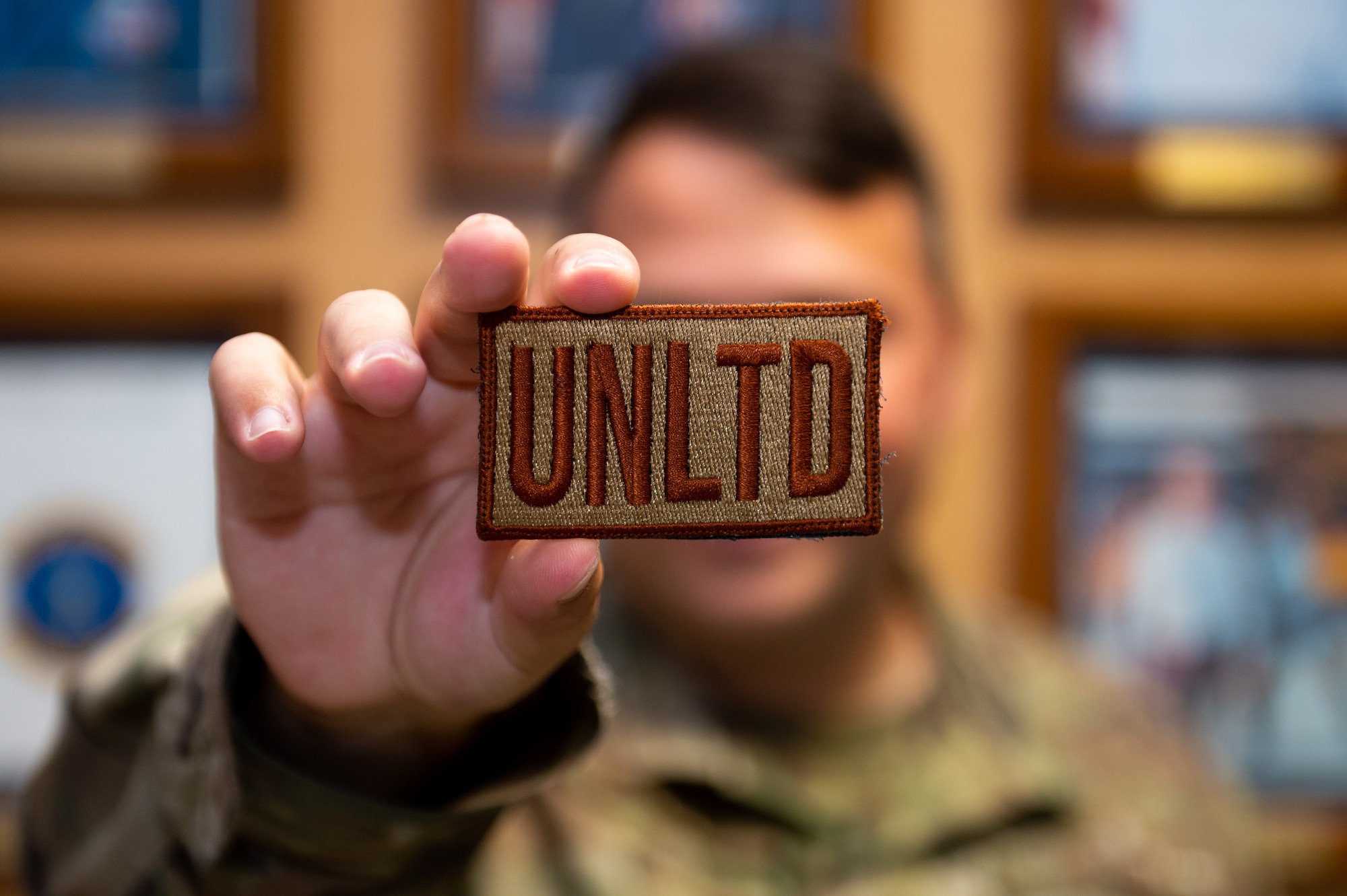 An Airman showing off his unlimited patch.
