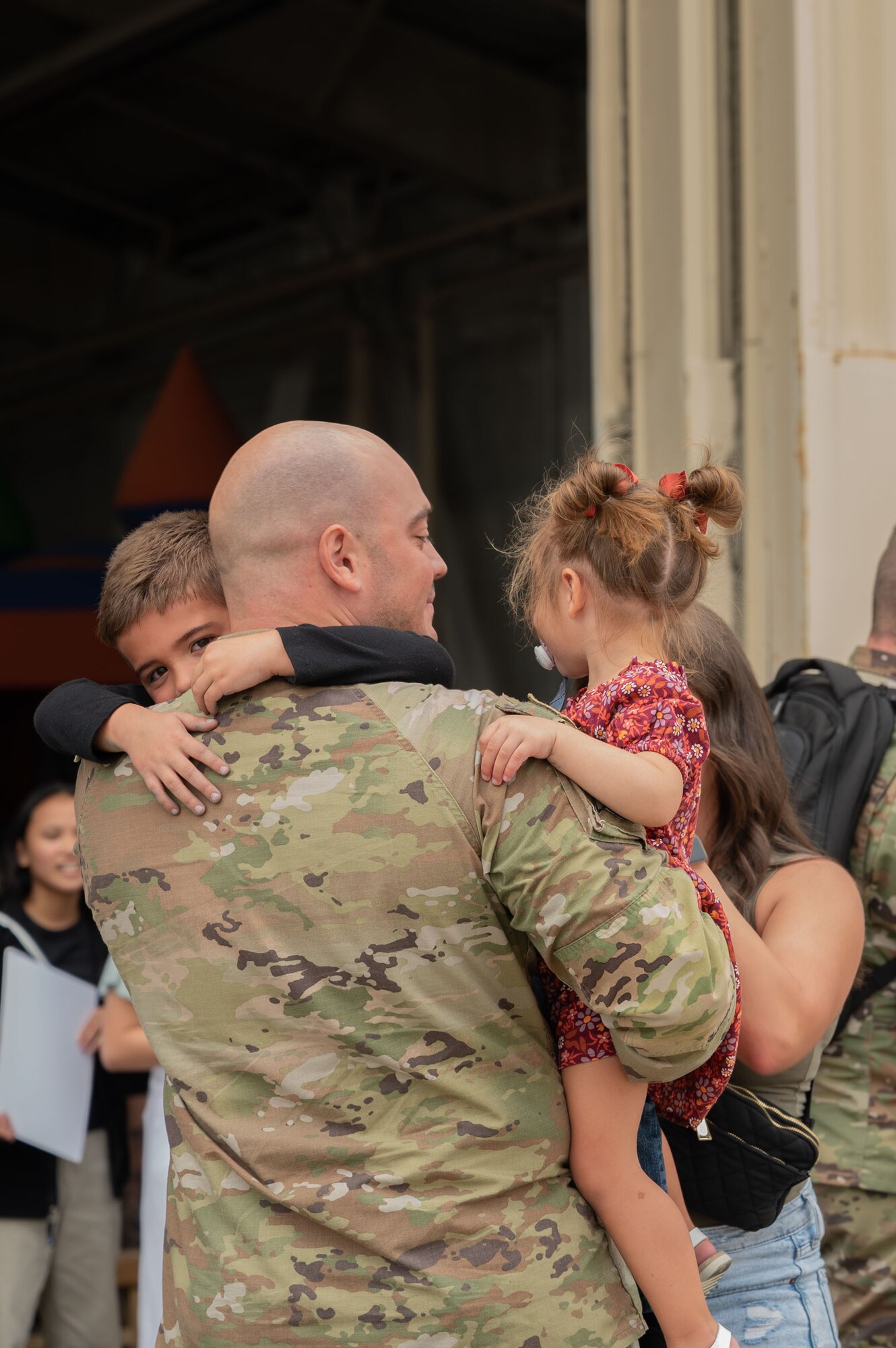 An Airman assigned to the 336th Fighter Generation Squadron greets his family during a homecoming ceremony at Seymour Johnson Air Force Base, North Carolina, Oct. 6, 2023. The 4th Fighter Wing deployed to provide a defensive posture to military personnel stationed in the Air Force’s Central Command area of responsibility. (U.S. Air Force photo by Airman 1st Class Rebecca Sirimarco-Lang)