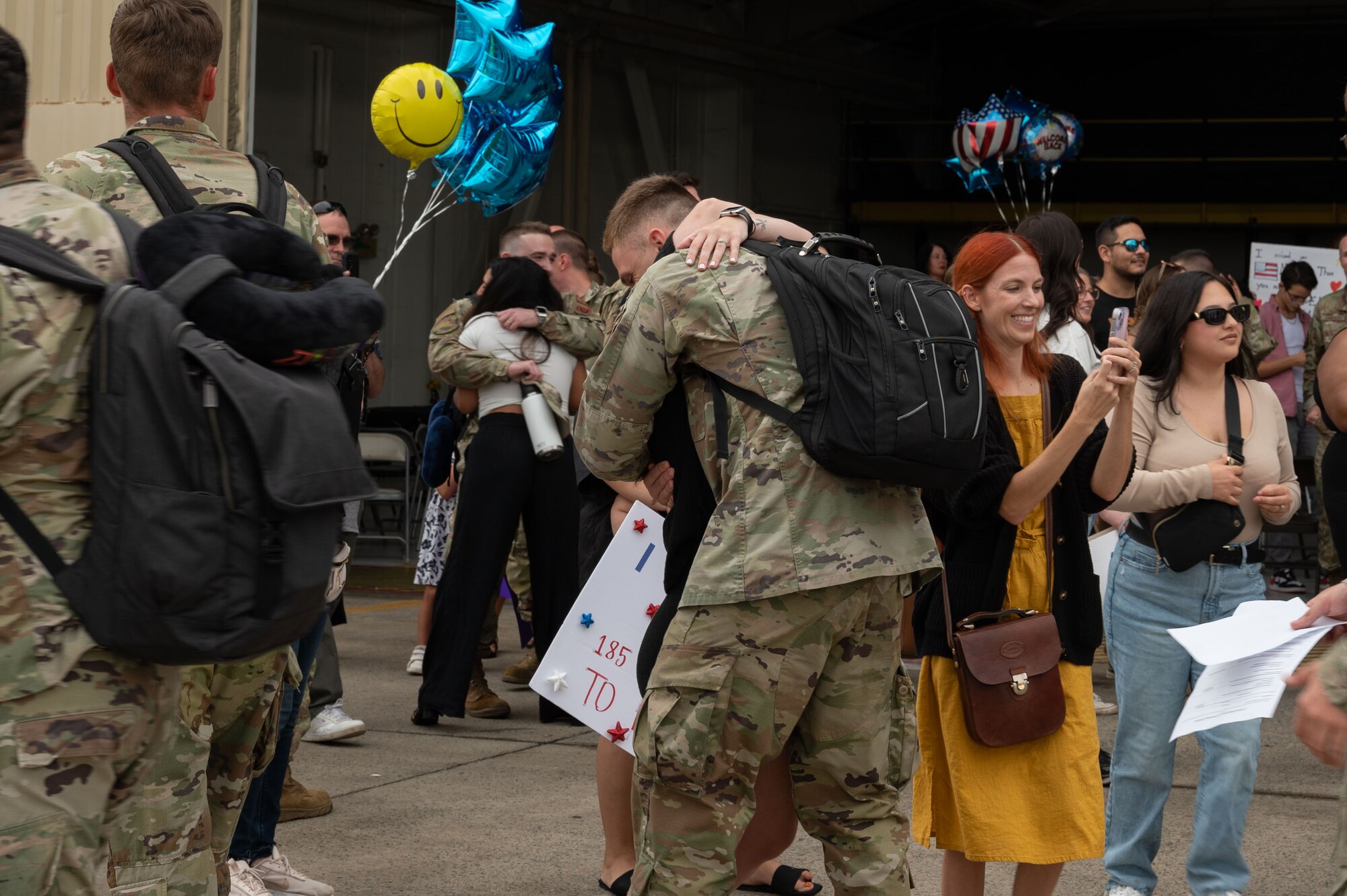 An Airman assigned to the 336th Fighter Generation Squadron greets his family during a homecoming ceremony at Seymour Johnson Air Force Base, North Carolina, Oct. 6, 2023.  The 4th Fighter Wing deployed to provide a defensive posture to military personnel stationed in the Air Force’s Central Command area of responsibility. (U.S. Air Force photo by Airman 1st Class Rebecca Sirimarco-Lang)